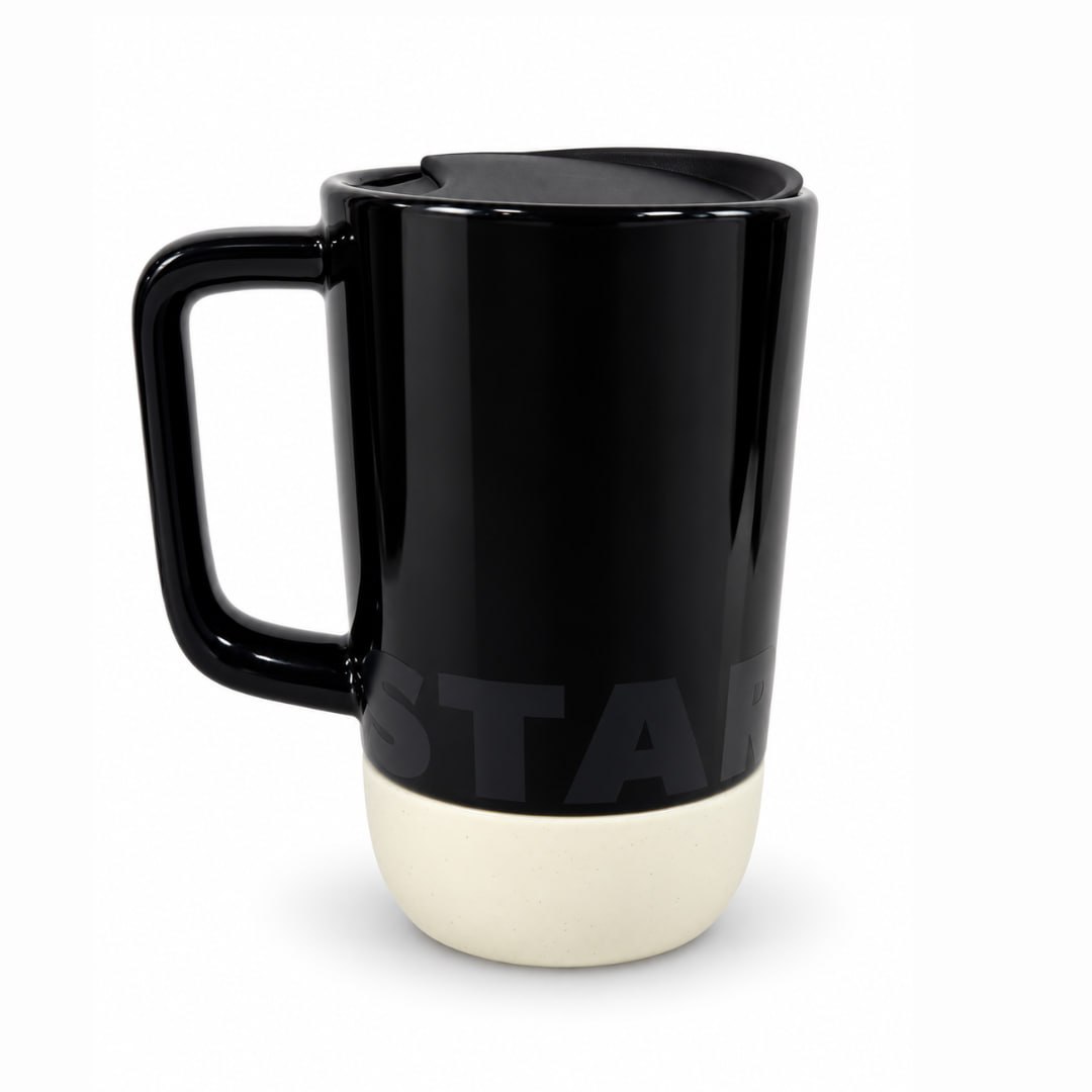Starbucks black 14 oz ceramic mug with black travel lid and cream silicone base